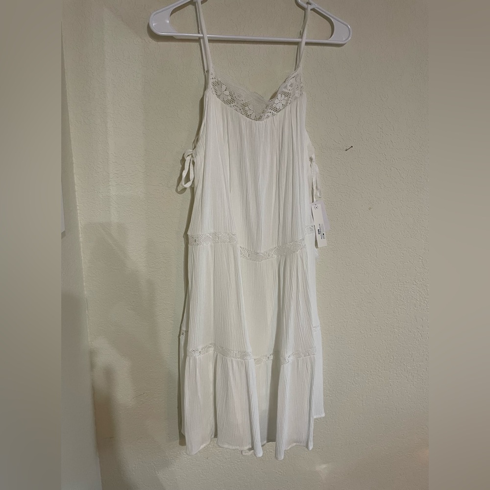 Summer is coming! Light and lined white w/ spaghetti straps. Lace trim